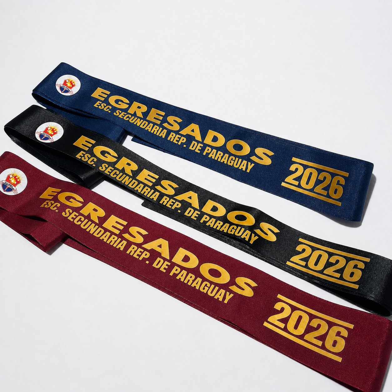 Tres bandas de Egresados 2026 en azul, negro y bordó